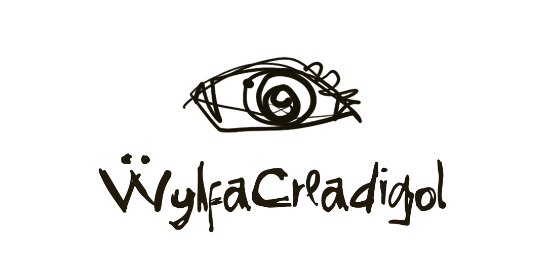 Logotipo "ẅylfaCreadigol" com olho rabiscado, criado com fonte Gritty Ink — demonstração de uso em identidade de marca e suporte a diacríticos